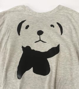 A t-shirt with a stylized graphic of a bear with a scarf on it.